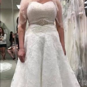 brand new wedding dress. never worn. still has the $1,300 tag on it.